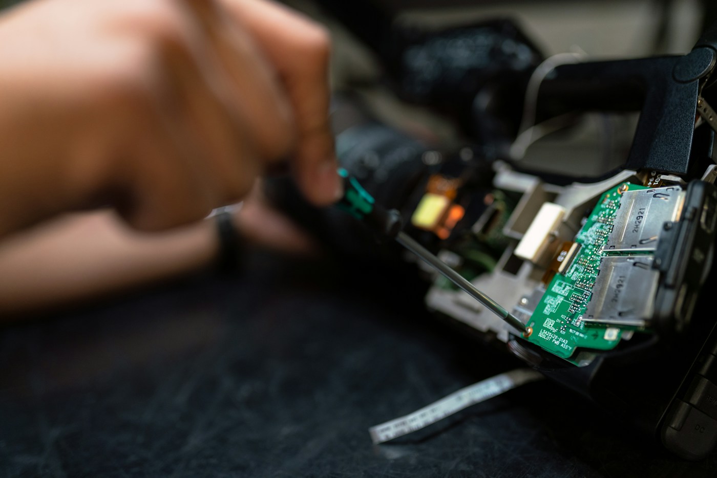 Technician inspecting an electronic assembly